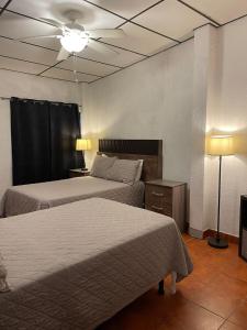 Ένα ή περισσότερα κρεβάτια σε δωμάτιο στο Gran Bonanza Hotel