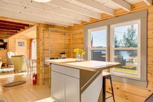 a kitchen with a counter and a large window at Direct Lake Access! Quiet Waukewan Retreat in Winona