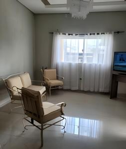 TV a/nebo společenská místnost v ubytování Casa ampla e confortável próximo ao centro