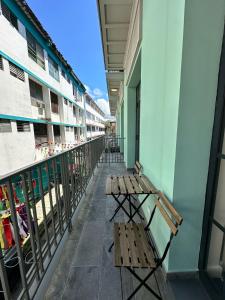 two benches on the balcony of a building at Stunning 1BR in Santa Ana Best Area in Panama City