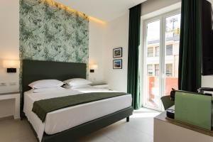 Postel nebo postele na pokoji v ubytování URBAN Palermo DOWNTOWN