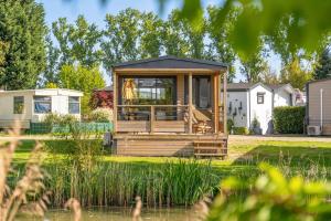 Κήπος έξω από το Camping Papillon Kinrooi - 138