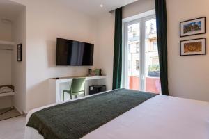 TV a/nebo společenská místnost v ubytování URBAN Palermo DOWNTOWN