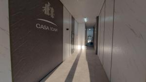a hallway of a building with a sign on the wall at Botanica Aeroport in Chişinău