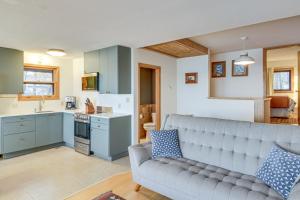 a living room with a couch and a kitchen at Mille Lacs Lake Retreat! Cabin with Private Dock in Bayview