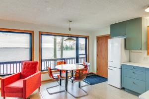 a kitchen with a table and chairs and a refrigerator at Mille Lacs Lake Retreat! Cabin with Private Dock in Bayview +18 photos