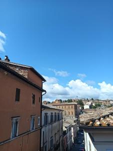 a view of a city from the roofs of buildings at Alloggio Turistico LA TORRE in Acquapendente
