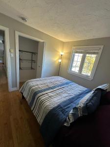 Postel nebo postele na pokoji v ubytování The Grand Estate -4 bedroom