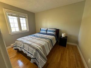 Postel nebo postele na pokoji v ubytování The Grand Estate -4 bedroom