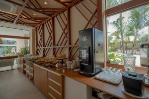 Nhà bếp/bếp nhỏ tại Refúgio Sol e mar Studio Resort em Muro Alto