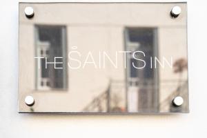 a sign that says the santim on a window at The Saints Inn in Athens +34 photos