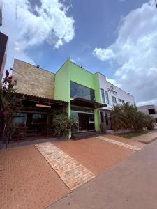 a building with a brick driveway in front of it at PUMMA BUDGET HOTEL in Canaã dos Carajás