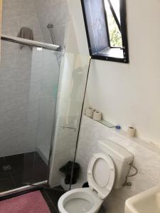 a bathroom with a toilet and a glass shower at Kleve-Kellen 2 in Kleve +4 photos