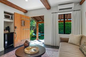 a living room with a couch and a table at Talavera Palm Springs in Palm Springs