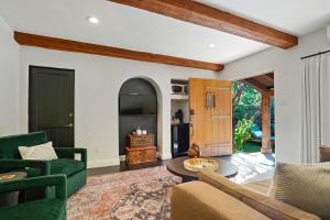 a living room with a couch and a table at Talavera Palm Springs in Palm Springs