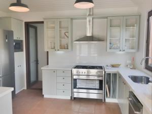 Η κουζίνα ή μικρή κουζίνα στο Casapueblo Rent Cachagua CP 14