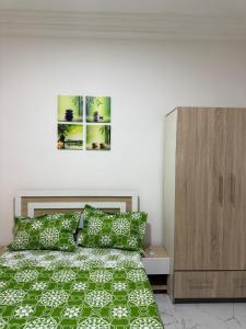 Ένα ή περισσότερα κρεβάτια σε δωμάτιο στο Élégance Urbaine Lomé