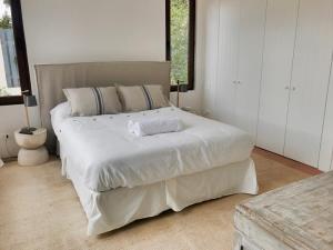 Ένα ή περισσότερα κρεβάτια σε δωμάτιο στο Casapueblo Rent Cachagua CP 34