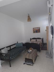 Giường trong phòng chung tại Riwaq Al Aziz