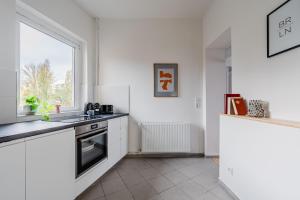 Køkken eller tekøkken på Modernes Apartment im Holländischen Viertel