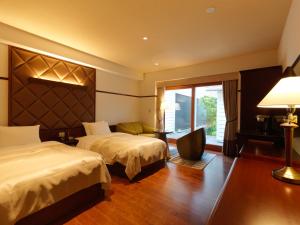 Ένα ή περισσότερα κρεβάτια σε δωμάτιο στο Hakodate Onuma Tsuruga Resort EPUY