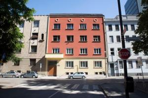 a stop sign in front of a tall building at Tomas's apartment in Ljubljana