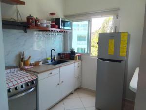 Kuchyň nebo kuchyňský kout v ubytování Rayo de sol condominio la Fenice