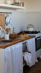 a kitchen with a counter with towels hanging from it at ALMAR Cabaña Boutique Frente al Mar in La Pedrera