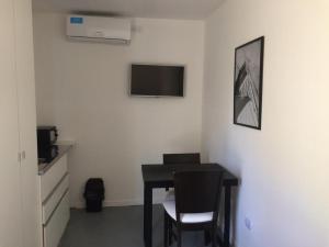 TV a/nebo společenská místnost v ubytování Chacras Coria Posada 1460