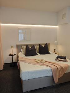 Ένα ή περισσότερα κρεβάτια σε δωμάτιο στο Ferienwohnung Backstube bei Sinsheim 2 Erwachsene 2 Kinder