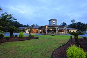 a large building with a clock tower on top at Best Western Point South in Yemassee