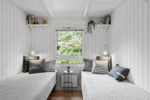 Ένα ή περισσότερα κρεβάτια σε δωμάτιο στο BL1133-Blokhus-Jens-Baerentsvej-19