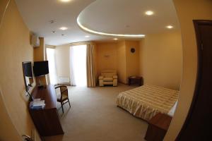 Ένα ή περισσότερα κρεβάτια σε δωμάτιο στο Hotel Nikol
