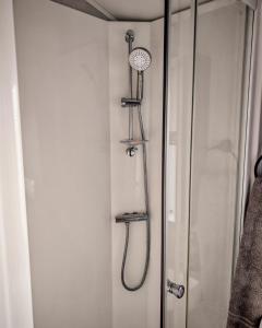 a shower in a bathroom next to a shower at Primrose Valley Primrose field 4 in Filey