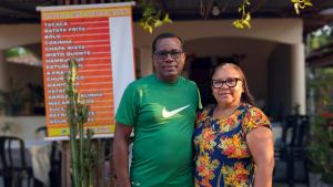 a man and a woman standing next to each other at Hospedagem Tia Lene Pacoval Soure in Soure +1 photo