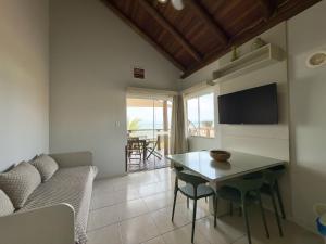 TV a/nebo společenská místnost v ubytování Hospedaria Sol da Manhã