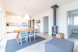 a kitchen and dining room with a table and chairs at BLE833-Lyckeby-Knoesoevaegen-98 in Lyckeby +16 photos