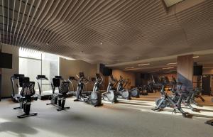 a gym with a bunch of exercise bikes and treadmills at Black Desert Resort in Ivins +65 photos