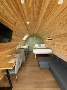 a room with a bed and a table and a sink at LUXURY POD - Hidden Hills Waterville Farm in Waterville +10 photos