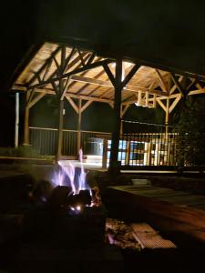 a fire pit in front of a building at night at Fresh Start in Jardin +26 photos