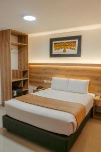 a bedroom with a large bed in a room at Antawa Hotel in Moquegua