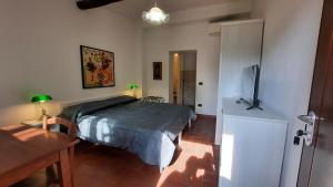 Postel nebo postele na pokoji v ubytování FATTORIA-AgriHotel -