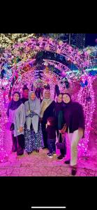 a group of people standing in front of a display of lights at Spacious 2-Storey & Connected Home Link Central i-City in Shah Alam +41 photos