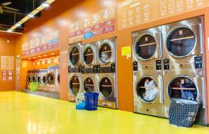 a row of washing machines in a store at Spacious 2-Storey & Connected Home Link Central i-City in Shah Alam