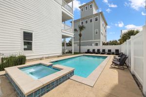 a swimming pool in the backyard of a house at Inlet Beach Reunion House by 30A Escapes in Inlet Beach