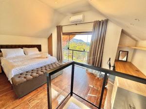 En eller flere senge i et værelse på Refúgio nas Montanhas