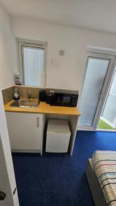 Kuchyň nebo kuchyňský kout v ubytování Restful Place