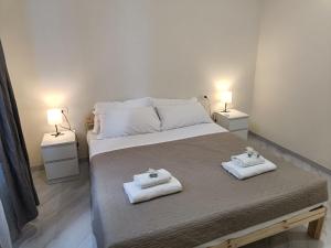 Postel nebo postele na pokoji v ubytování Santo Spirito Rooms