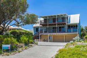 a large house with a balcony and a driveway at Ocean Vista Large Modern Home With Ocean Views in Guilderton