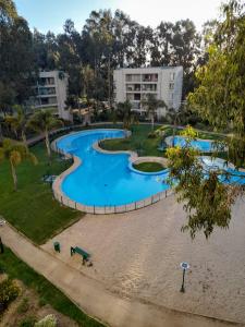 an image of a swimming pool at a resort at Departamento Costa Algarrobo Norte in Mirasol